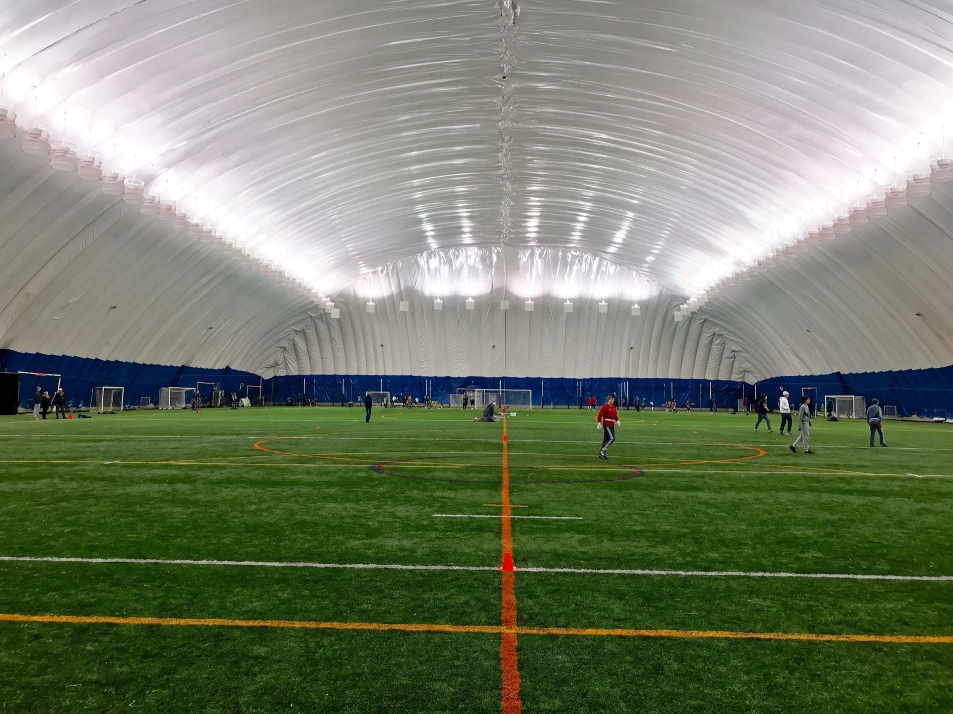 Players on the full-size indoor turf inside the Braemar Field dome on a match night